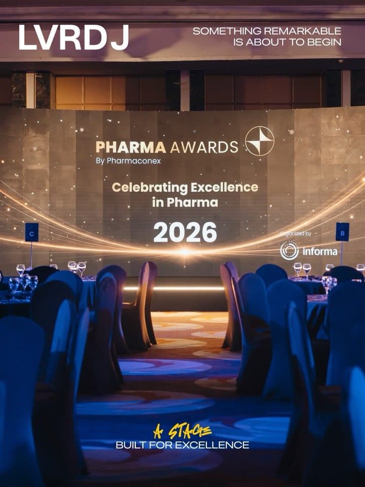 Pharma Awards 2026 ballroom, blue-lit tables facing the main stage